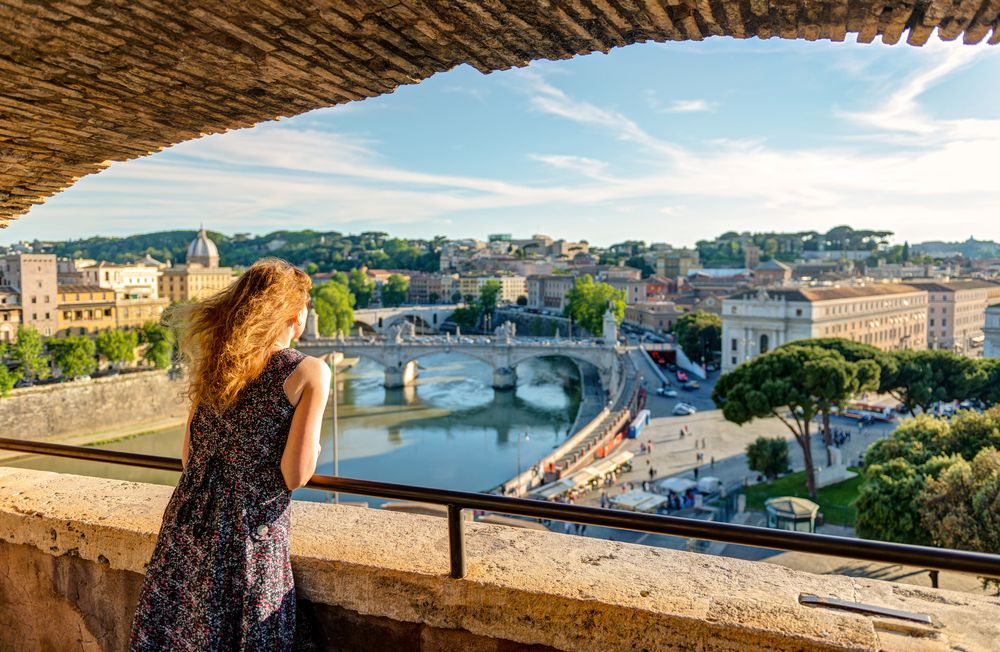 Tourist,Admiring,View,Of,Rome,From,Castel,Sant’angelo,,Italy,,Europe.