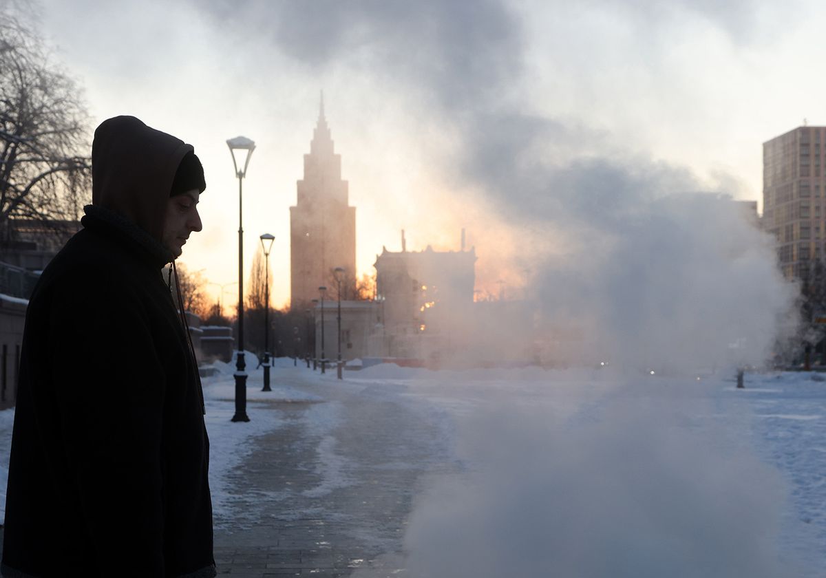 MOSCOW, RUSSIA - JANUARY 8:  (RUSSIA OUT) A man walks along the street near the Alcon tower building, as air temperatures dropped to -18 degrees Celcius, January,8 2024, in Moscow, Russia. Since the beginning of the year, abnormally cold weather has settled in Moscow region, causing problems with heating in apartments. (Photo by Contributor/Getty Images)