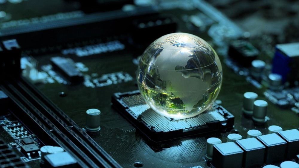 Concept,Of,Green,Technology.,Crystal,Globe,On,Circuit,Board,Technology