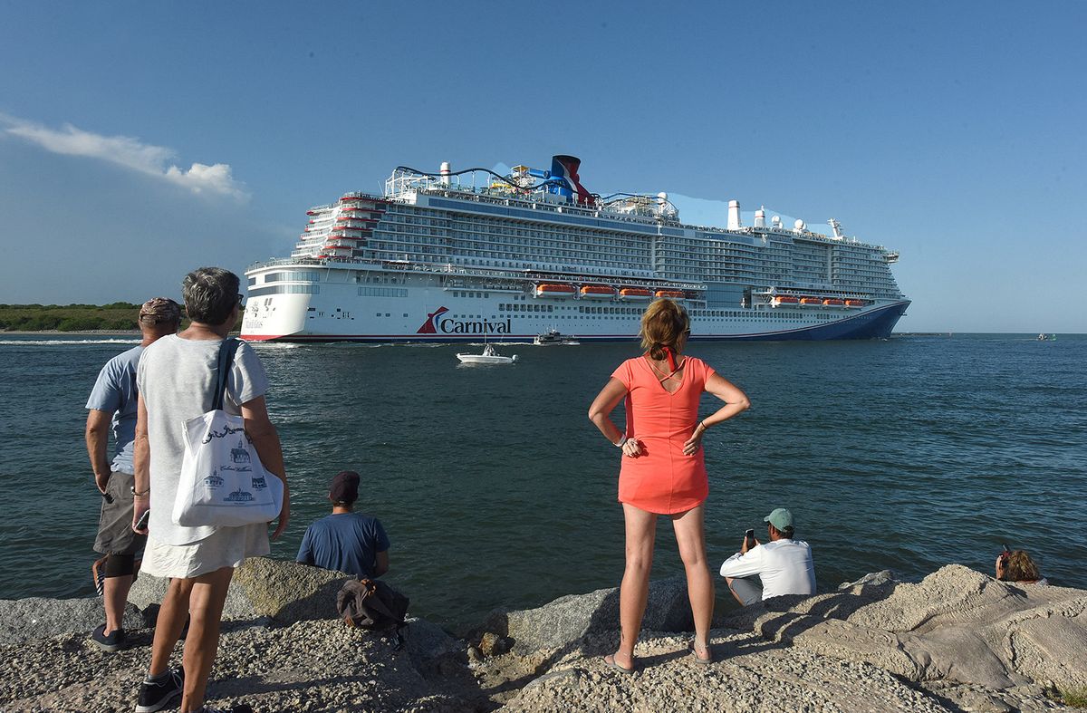 PORT CANAVERAL, FLORIDA, UNITED STATES - JULY 31: People come out to watch the new Carnival Cruise Line ship Mardi Gras as it departs on its maiden voyage, a seven-day cruise to the Caribbean from Port Canaveral, Florida on July 31, 2021. This is the first cruise from Port Canaveral with paying passengers since March of 2020 when the cruise industry shut down amid the coronavirus pandemic. Paul Hennessy / Anadolu Agency (Photo by Paul Hennessy / ANADOLU AGENCY / Anadolu via AFP)
