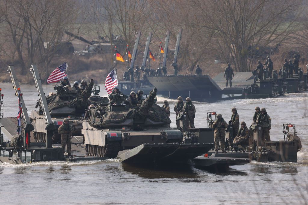 NATO Holds Dragon 24 Military Exercises As Part Of Steadfast DefenderGNIEW, POLAND - MARCH 04: The German/British Amphibious Engineer Battalion 130 ferries U.S. Army M1 Abrams main battle tanks on M3 amphibious rigs across the Vistula River during the NATO Dragon 24 river crossing military exercise on March 04, 2024 near Gniew, Poland. Dragon 24 is involving 20,000 troops from 10 different nations and is part of Steadfast Defender 2024, an ongoing set of NATO military manoeuvres across Europe that is involving 90,000 troops. (Photo by Sean Gallup/Getty Images)