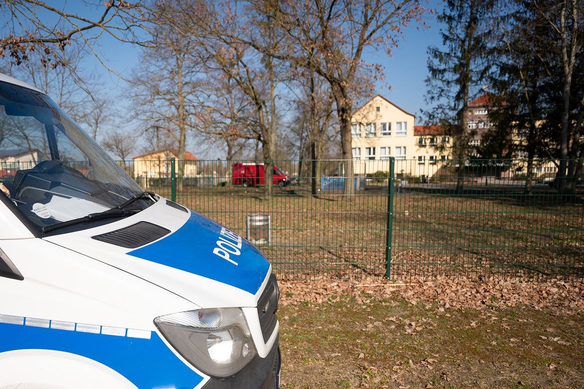 08 March 2024, Brandenburg, Petershagen: A police car is parked outside a school. A 22-year-old man was arrested at the school for carrying a knife and a firearm. The man was arrested. Photo: Christophe Gateau/dpa (Photo by Christophe Gateau / DPA / dpa Picture-Alliance via AFP)