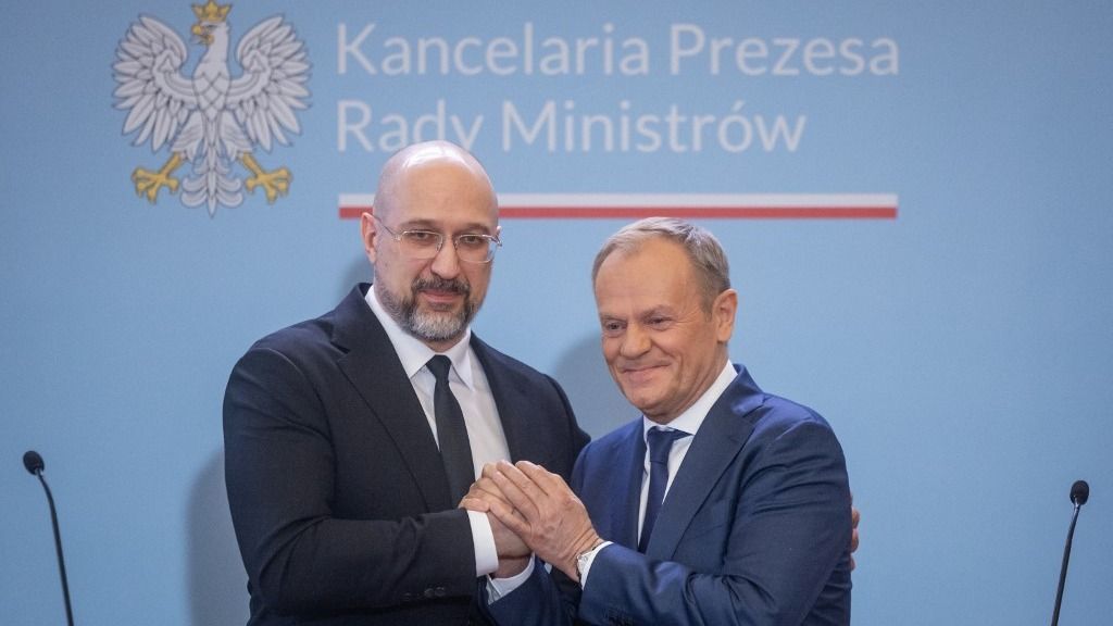Ukraine's Prime Minister Denys Shmyhal (L) and Polish Prime Minister Donald Tusk shake hands after a joint press conference after bilateral talks to resolve a conflict over farm imports in Warsaw on March 28, 2024. Polish farmers have been blocking border crossings with Ukraine since last month to protest at what they say is unfair competition from goods from the war-torn country. (Photo by Wojtek Radwanski / AFP)