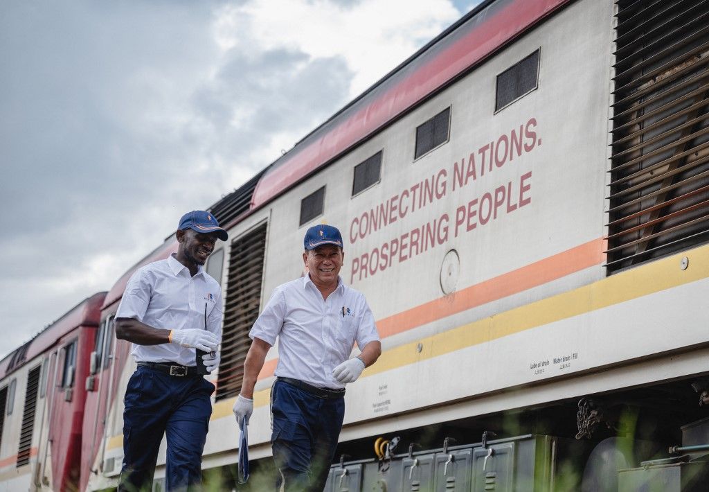 KENYA-NAIROBI-CHINESE-BUILT (230601) -- NAIROBI, June 1, 2023 (Xinhua) -- Chinese instructor Jiang Liping (R) and apprentice Horace Owiti walk past a train carriage on the Mombasa-Nairobi Railway with a printed slogan reading "connecting nations, prospering people" in Nairobi, Kenya, May 23, 2023. Jiang is a train driver of the Africa Star Railway Operation Company. He came to Kenya in 2018 and was responsible for the technical training of drivers and supervision of standardized operation. Horace is Jiang's apprentice, and they work together along the Mombasa-Nairobi railway. "Horace is intelligent and hardworking," Jiang said, "I hope the apprentices will come to visit China as guests, because we are not only colleagues but also friends." Horace said that he has benefited a lot from the professional training of the Chinese instructors. "I hope they can come back to Kenya often," he said. In the future, he plans to train more reliable drivers for the Mombasa-Nairobi railway.
  The Mombasa-Nairobi Standard Gauge Railway in Kenya has become a flagship project of China-Africa cooperation, a "business card" of Chinese enterprises and a demonstration project of the Belt and Road Initiative.
  The 480-km rail line, linking the largest port in East Africa, Mombasa, to Kenya's capital Nairobi, was built by the China Road and Bridge Corporation and officially opened to traffic in 2017. 
  The project has gained trust and support from the Kenyan government and people and injected vitality into the country's socio-economic development, since Africa Star Railway Operation Company (AfriStar), the railway operator, has always been committed to ensuring safe operation, boosting the movement of passengers and goods, and enhancing localization of the project.
  Chinese experts have been saving no effort in training local staff members and transfer technologies and know-hows to their local counterparts since the railway project started from scratch.
  After years of professional training and practice, many KenyRAILWAY-TALENTS-TRAINING