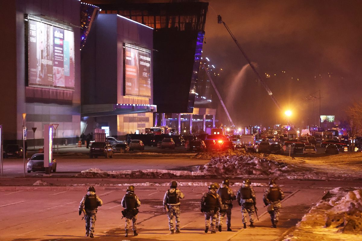 KRASNOGORSK, RUSSIA - MARCH 22: (RUSSIA OUT) Russian National Guard Service gather as fire rages inside the Crocus City Hall on March 22, 2024 in Krasnororsk, Russia. Early reports indicated multiple people were killed and many were wounded when several gunmen opened fire on the venue. (Photo by Contributor/Getty Images)