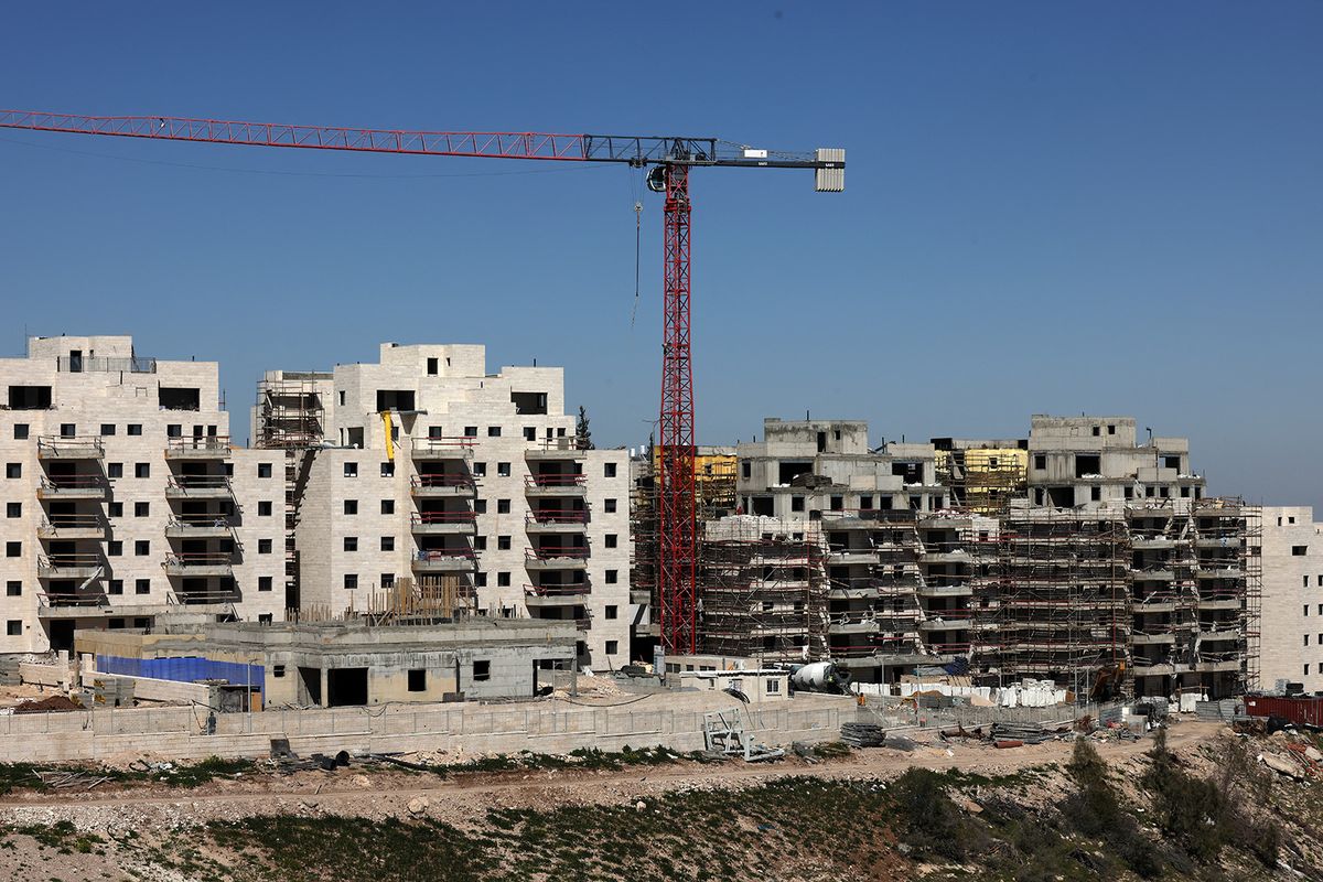 A pictures shows new buildings at a construction site in the Israeli settlement of Maale Adumim, in the occupied West Bank, on February 29, 2024. Far-right Israeli Finance Minister Bezalel Smotrich announced that in response to a shooting attack in which gunmen opened fire at queuing cars on a West Bank highway, killing one man on February 22, the government would submit plans for the construction of some 3,300 additional housing units in the nearby settlement of Maale Adumim. (Photo by Menahem KAHANA / AFP)