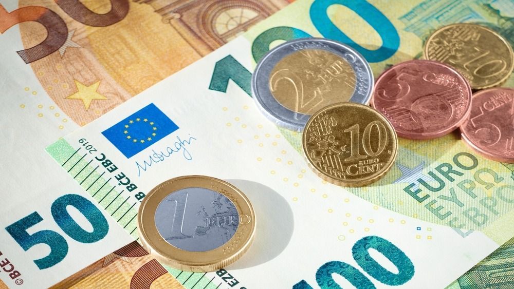 Eu,Euro,Coins,On,Heap,Of,Euro,Bills.,Eu,Economy