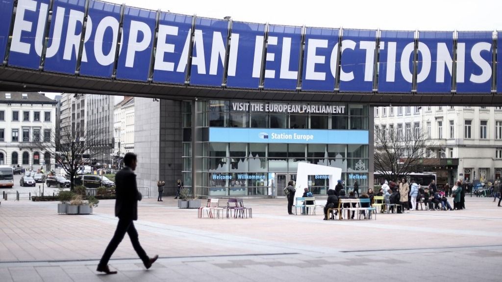 A man walks past a banner which reads as "European Elections", displayed on the building of the European Parliament in Brussels, on February 21, 2024, ahead of the European elections scheduled between June 6 and June 9, 2024. (Photo by Kenzo TRIBOUILLARD / AFP) TikTok