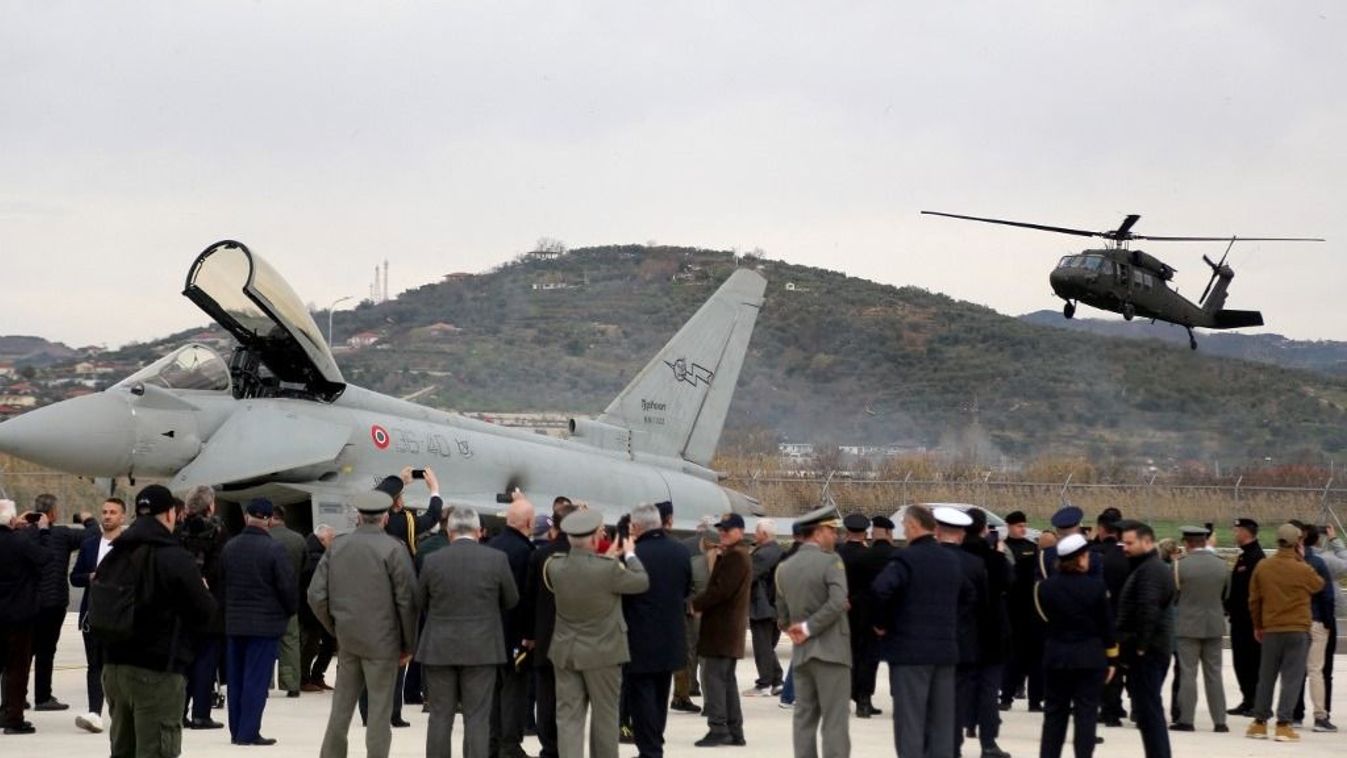 Politicians and military staff stand in front of Italian air force Typhoon fighter jets during a ceremony at the newly refurbished NATO-backed airbase in the Albanian city of Kucova, 90 kilometers south of capital Tirana on March 4, 2024. Albania unveiled a newly refurbished NATO-backed airbase, highlighting the alliance's expanding footprint in southeast Europe as tensions over Russia's invasion of Ukraine rattles the region.
STRINGER / AFP