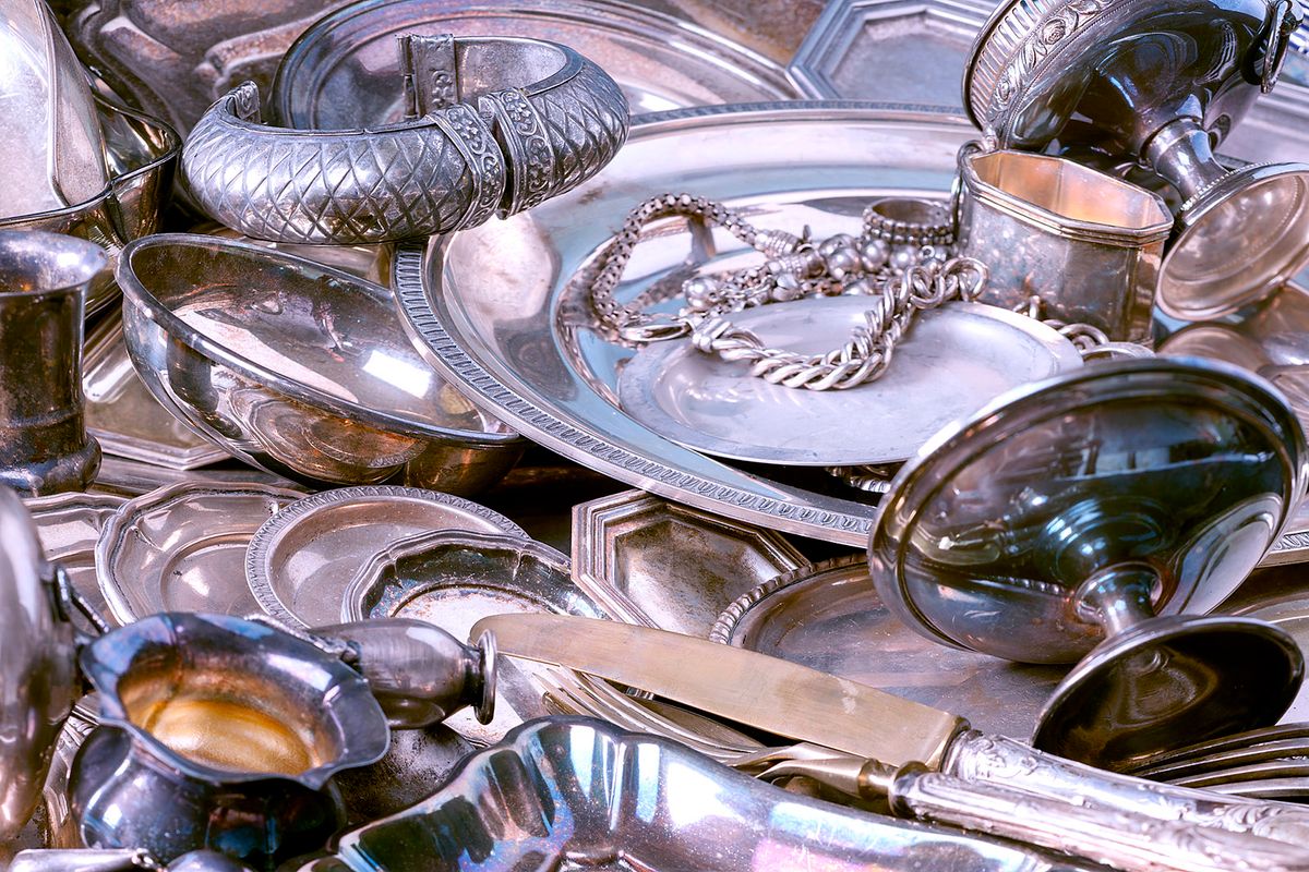 Antique Silverware and Old Silver Jewelry Background