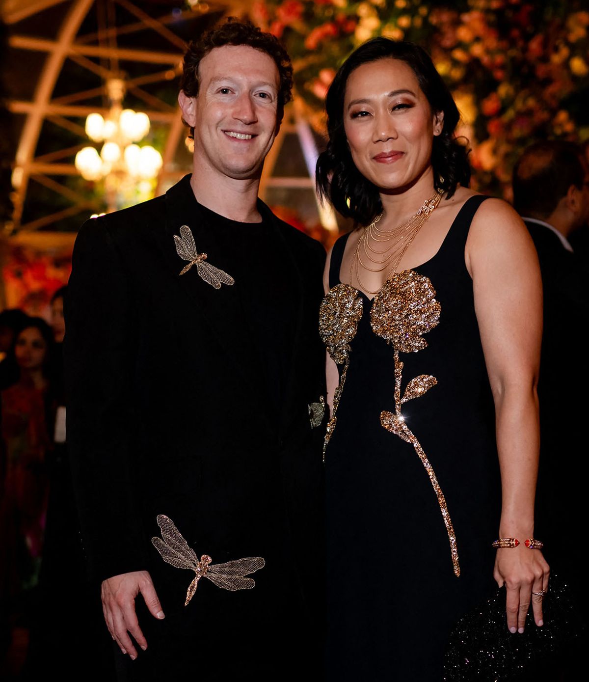 This handout photograph taken and released by Reliance on March 1, 2024, shows Meta chief Mark Zuckerberg (L) with his wife Priscilla Chan attending a three-day pre-wedding celebration hosted by billionaire tycoon Mukesh Ambani, for his son Anant Ambani and Radhika Merchant in Jamnagar. Rihanna and Meta chief Mark Zuckerberg were in India on March 1, for an extravagant pre-wedding party hosted by Asia's richest man, with celebrations expected to include other globally influential figures. (Photo by Reliance / AFP) / RESTRICTED TO EDITORIAL USE - MANDATORY CREDIT "AFP PHOTO /RELIANCE" - NO MARKETING NO ADVERTISING CAMPAIGNS - DISTRIBUTED AS A SERVICE TO CLIENTS