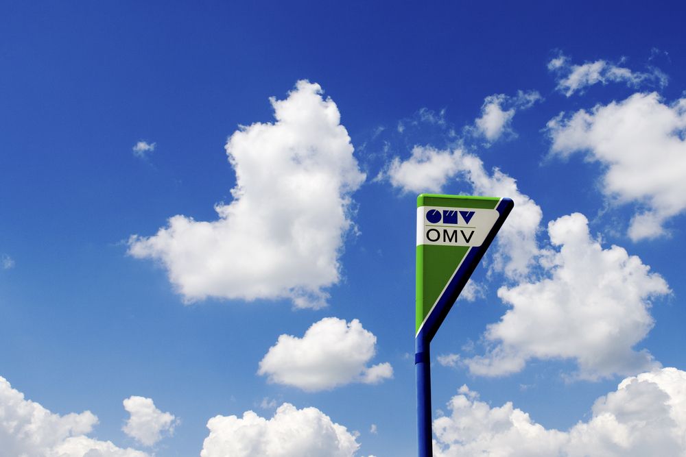 OMV 
Cluj,,Romania,,2017.,Omv,Sign,,On,A,Cloudy,Sky
