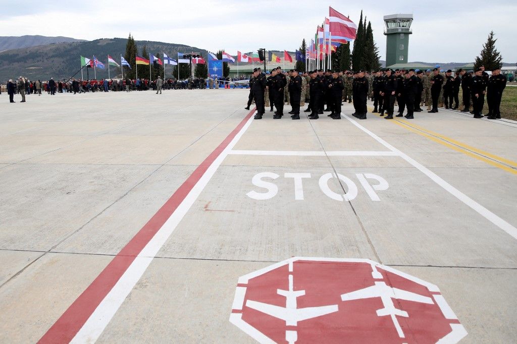 Politicians and military staff gather at the newly refurbished NATO-backed airbase in Kucova, 90 kilometers south of capital Tirana on March 4, 2024, during the inaugural ceremony. Albania unveiled a newly refurbished NATO-backed airbase, highlighting the alliance's expanding footprint in southeast Europe as tensions over Russia's invasion of Ukraine rattles the region.
STRINGER / AFP