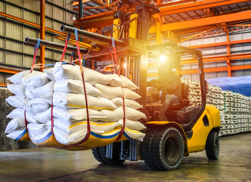 Forklift,Handling,Sugar,Bag,For,Stuffing,Into,Container,For,Export.