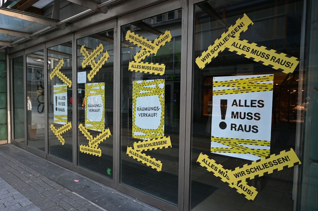 Closure of business26 December 2023, North Rhine-Westphalia, Cologne: A store closes. Signs in the shop windows saying everything must go. Photo: Horst Galuschka/dpa (Photo by Horst Galuschka/picture alliance via Getty Images)