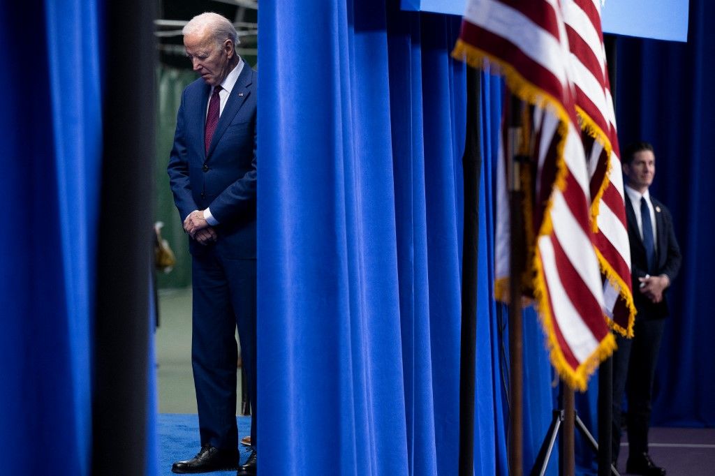 US President Joe Biden waits behind a curtain before speaking about the costs of living during an address at the YMCA Allard Center March 11, 2024, in Goffstown, New Hampshire. (Photo by Brendan Smialowski / AFP)
