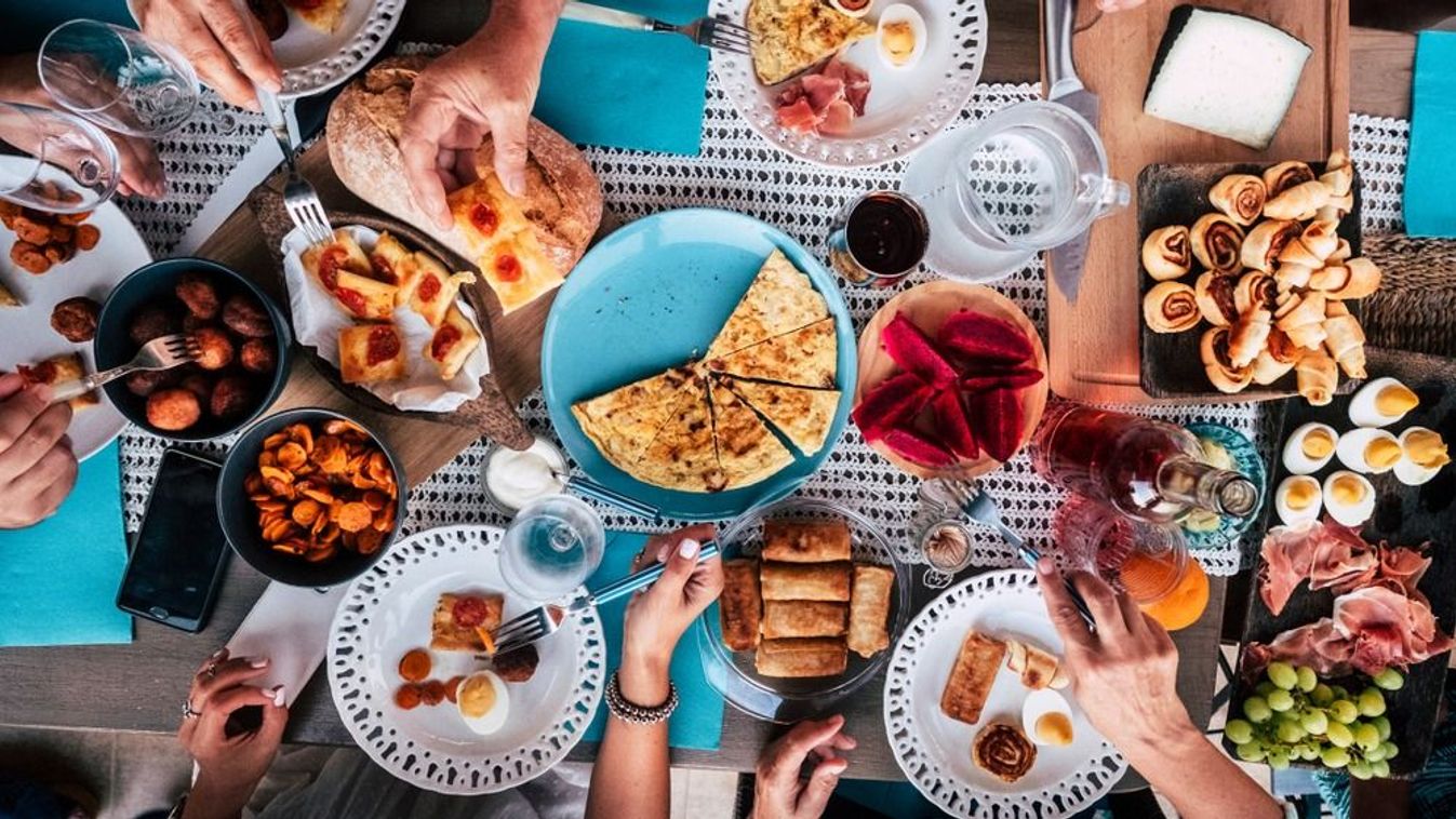 Above,Aerial,View,Of,Group,Of,Friends,Having,Fun,Eating