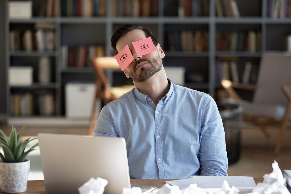 Exhausted,Tired,Businessman,With,Painted,Eyes,On,Stickers,,Adhesive,Notes