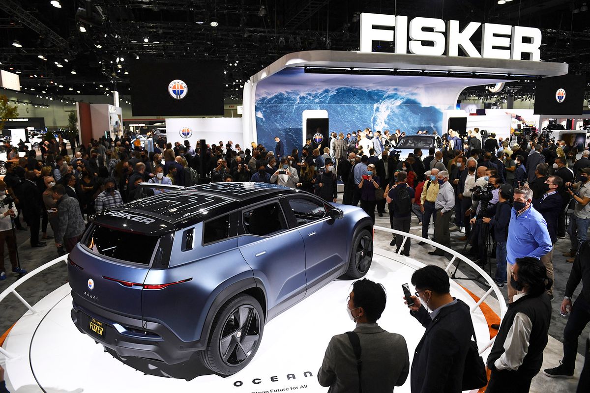 Attendees view the Fisker Ocean electric vehicle after its unveiling during AutoMobility LA ahead of the Los Angeles Auto Show on November 17, 2021 in Los Angeles, California. (Photo by Patrick T. FALLON / AFP)