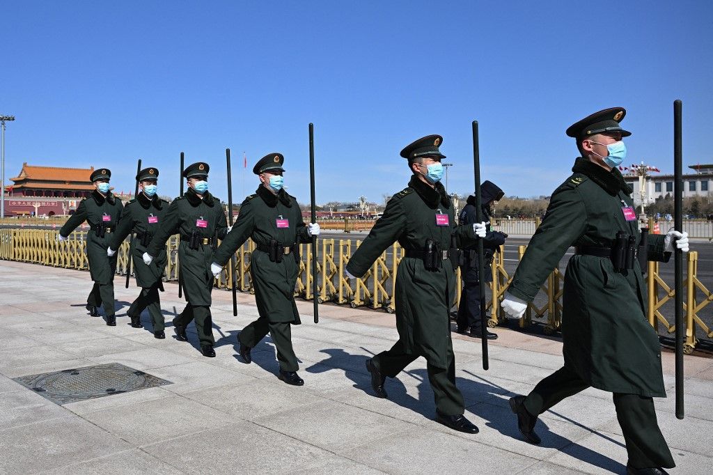 Chinese People’s Liberation Army (PLA) soldiers march outside the Great Hall of People during the 14th National People's Congress (NPC) in Beijing on March 6, 2024. (Photo by Jade Gao / AFP)