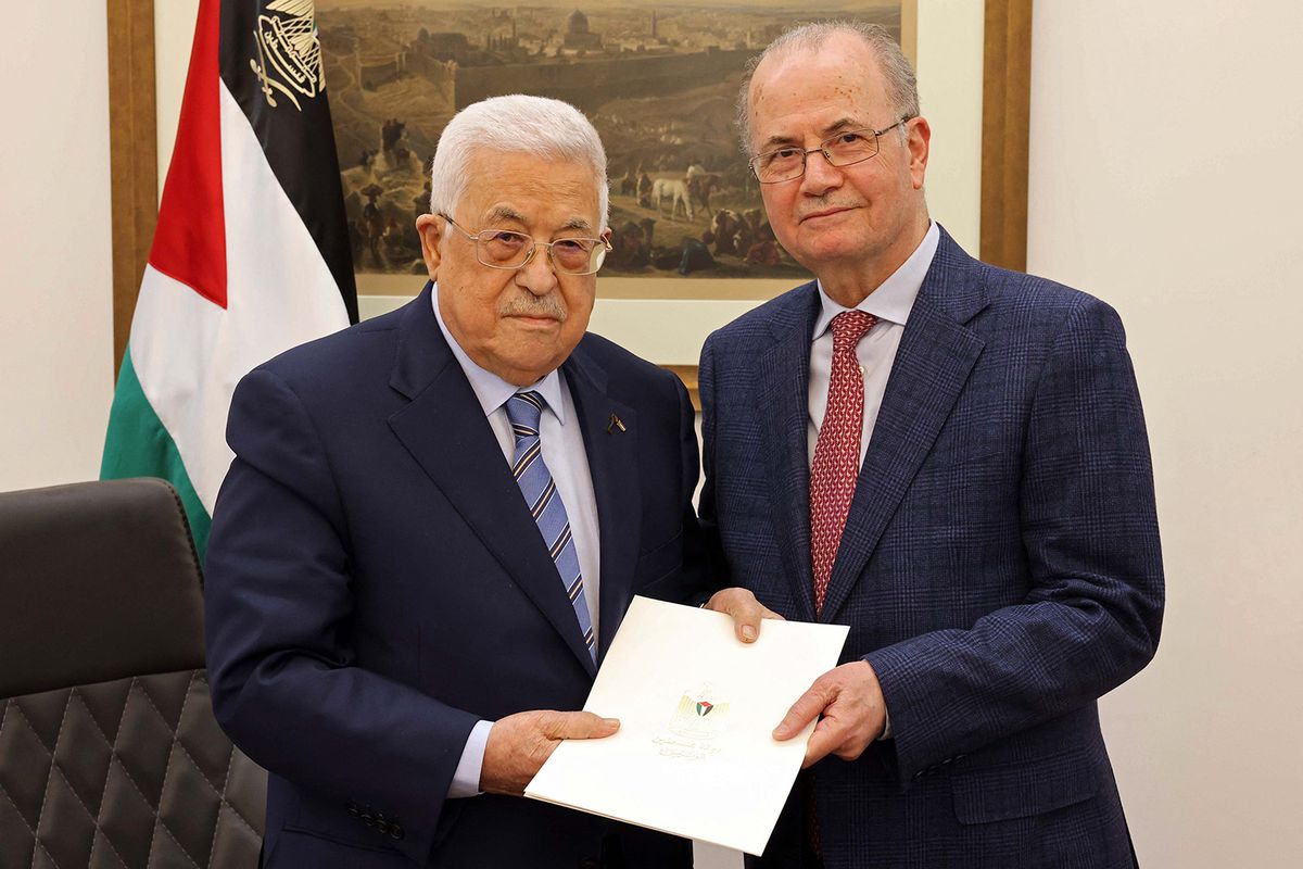 This handout picture provided by the Palestinian Authority's Press Office (PPO) shows Palestinian President Mahmud Abbas (L) posing with the newly appointed Palestinian Prime Minister Mohammad Mustafa, in Ramallah on March 14, 2024. Abbas has appointed Mohammed Mustafa, a long-trusted adviser on economic affairs, as prime minister, the official Wafa news agency said. (Photo by PPO / AFP) / === RESTRICTED TO EDITORIAL USE - MANDATORY CREDIT "AFP PHOTO/HO/PPO" - NO MARKETING NO ADVERTISING CAMPAIGNS - DISTRIBUTED AS A SERVICE TO CLIENTS ===