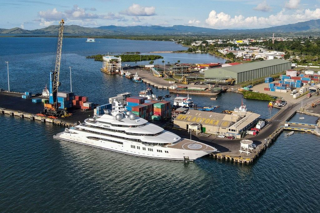 A photo taken on April 13, 2022 shows the superyacht Amadea, reportedly owned by a Russian oligarch, berthed at the Queens Wharf in Lautoka. Fijian authorities on April 19 applied to block a superyacht reportedly owned by Russian oligarch Suleiman Kerimov from leaving its waters, as the United States moved to seize it due to US and European Union sanctions over Russia's invasion of Ukraine. (Photo by Leon LORD / FIJI SUN / AFP) / Fiji OUT / ----EDITORS NOTE ----RESTRICTED TO EDITORIAL USE MANDATORY CREDIT " AFP PHOTO / FIJI SUN / LEON LORD" NO MARKETING NO ADVERTISING CAMPAIGNS
