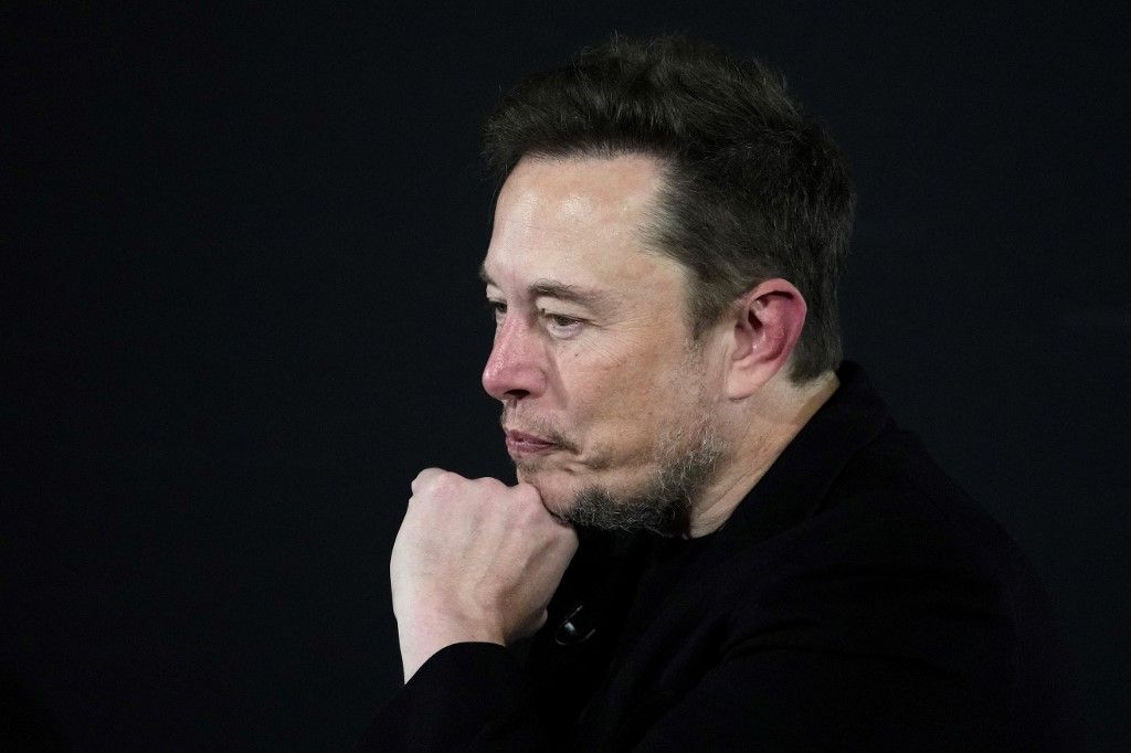 (FILES) X (formerly Twitter) CEO Elon Musk gestures during an in-conversation event with Britain's Prime Minister Rishi Sunak in London on November 2, 2023, following the UK Artificial Intelligence (AI) Safety Summit. Former top executives of Twitter sued  Musk on March 4, 2024 saying he has failed to pay them nearly $130 million after the billionaire took over the social media company and dismissed them. (Photo by Kirsty Wigglesworth / POOL / AFP)