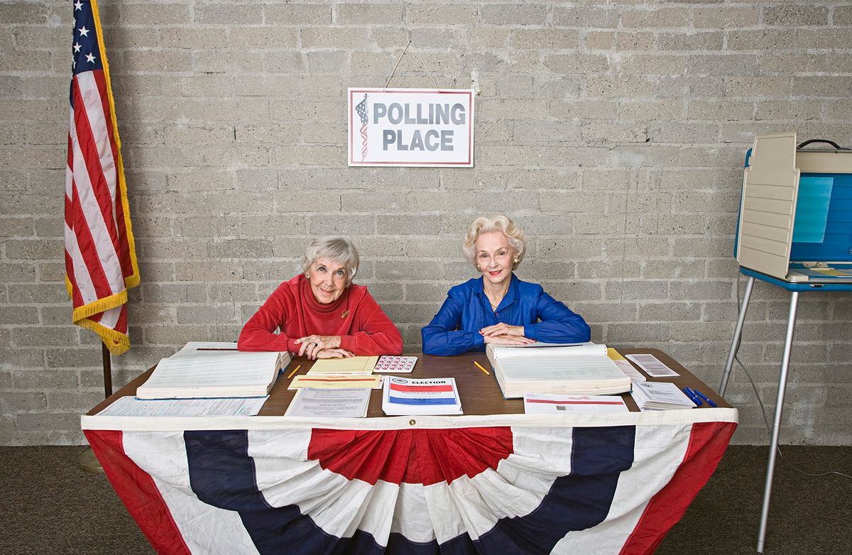 Senior women at polling place table