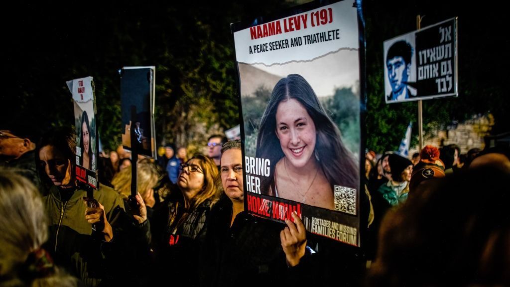 A protester holds a poster of Naama Levi who is held hostageJERUSALEM, ISRAEL - 2024/03/02: A protester holds a poster of Naama Levi who is held hostage by Hamas in Gaza during a demonstration march. Protesters gathered for a demonstration march demanding the release of hostages taken on October 7 by Hamas, a Gaza-based armed organization. This protest was triggered by Hamas's response during hostage deal negotiations in Paris last weekend. Hamas declined to address Jerusalem's request for a list of living hostages, saying it could not gather such a list because the hostages were being held at different locations by different groups. (Photo by Eyal Warshavsky/SOPA Images/LightRocket via Getty Images)JERUSALEM, ISRAEL - 2024/03/02: A protester holds a poster of Naama Levi who is held hostage by Hamas in Gaza during a demonstration march. Protesters gathered for a demonstration march demanding the release of hostages taken on October 7 by Hamas, a Gaza-based armed organization. This protest was triggered by Hamas's response during hostage deal negotiations in Paris last weekend. Hamas declined to address Jerusalem's request for a list of living hostages, saying it could not gather such a list because the hostages were being held at different locations by different groups. (Photo by Eyal Warshavsky/SOPA Images/LightRocket via Getty Images)