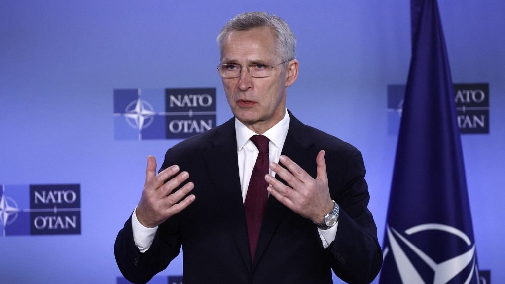 North Atlantic Treaty Organization (NATO) Secretary General Jens Stoltenberg (R) speaks as Ukranian Minister for Foreign listens on during the alliance's 75th anniversary at the NATO Headquarters in Brussels on April 4, 2024. The NATO military alliance on April 4, 2024, marks the 75th anniversary of the signing of its founding treaty in Washington. (Photo by KENZO TRIBOUILLARD / AFP)