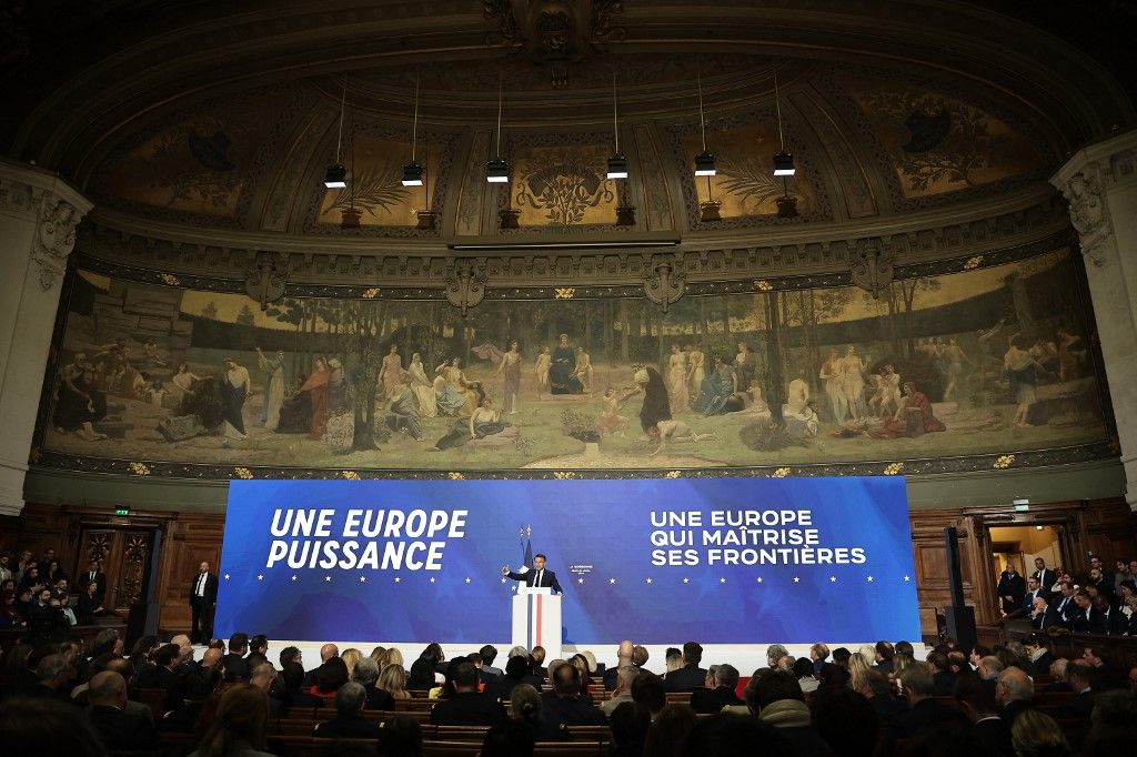French President Emmanuel Macron delivers a speech on Europe, in front of slogans which read "A powerful Europe" and "A Europe in charge of its borders" in an amphitheatre of the Sorbonne University in Paris, on April 25, 2024. President Emmanuel Macron gives a speech setting out his European policy directions ahead of the European elections on 09 June. (Photo by Christophe PETIT TESSON / POOL / AFP)