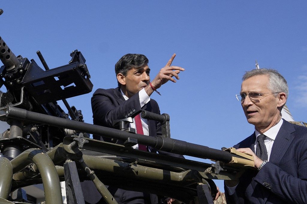NATO Secretary General Jens Stoltenberg (R) and Britain's Prime Minister Rishi Sunak inspect military equipment at the Warsaw Armoured Brigade in Warsaw, Poland, on April 23, 2024. The talks of Britain's Prime Minister Rishi Sunak with his Polish counterpart Donald Tusk and NATO Secretary General Jens Stoltenberg are expected to focus on Ukraine and wider European security. While in Poland's capital, the British Prime minister will announce £500 million ($617 million) in additional military funding for Kyiv in its more-than two-year battle against Russia's full-scale invasion, his Downing Street office said in a statement. (Photo by Alastair Grant / POOL / AFP)