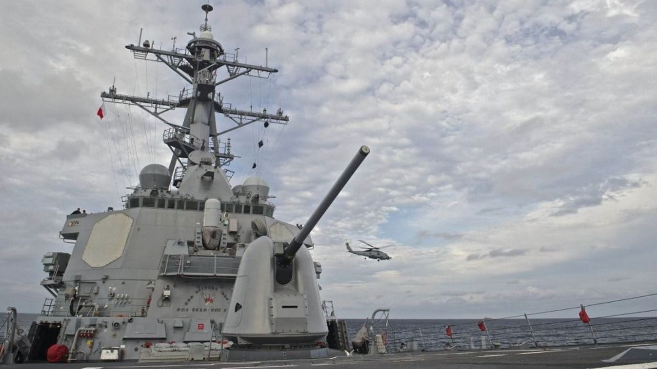 This US Navy photo obtained October 21, 2016 shows An MH-60R Sea Hawk, assigned to Helicopter Maritime Strike Squadron (HSM) 49,as it takes off from the flight deck aboard the guided-missile destroyer USS Decatur (DDG 73) on September 14, 2016 in the Sea of Japan. A US destroyer sailed close to a string of islands claimed by China in the South China Sea on October 21, 2016, the Pentagon said, amid continued tensions in the contested waterway. The USS Decatur passed close to the Paracel Islands and "conducted this transit in a routine, lawful manner without ship escorts and without incident," Pentagon spokesman Commander Gary Ross said. (Photo by MC3 Gerald Dudley REYNOLDS / Navy Media Content Operations (N / AFP) / RESTRICTED TO EDITORIAL USE - MANDATORY CREDIT "AFP PHOTO / US NAVY/Specialist 3rd Class Gerald Dudley Reynolds" - NO MARKETING NO ADVERTISING CAMPAIGNS - DISTRIBUTED AS A SERVICE TO CLIENTS