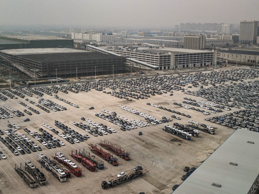 An aerial photo is showing new energy vehicles parked at a parking lot at the BYD Auto factory in Hefei, Anhui province, China, on March 28, 2024. (Photo by Costfoto/NurPhoto) (Photo by CFOTO / NurPhoto / NurPhoto via AFP)