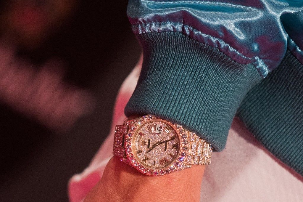 The diamond Rolex DayDate watch of US-American rapper Rapper Macklemore can be seen at the award ceremony of the '1Live Krone' award at the Jahrhunderthalle event hall in Bochum, Germany, 7 December 2017. Photo: Rolf Vennenbernd/dpa (Photo by ROLF VENNENBERND / DPA / dpa Picture-Alliance via AFP)