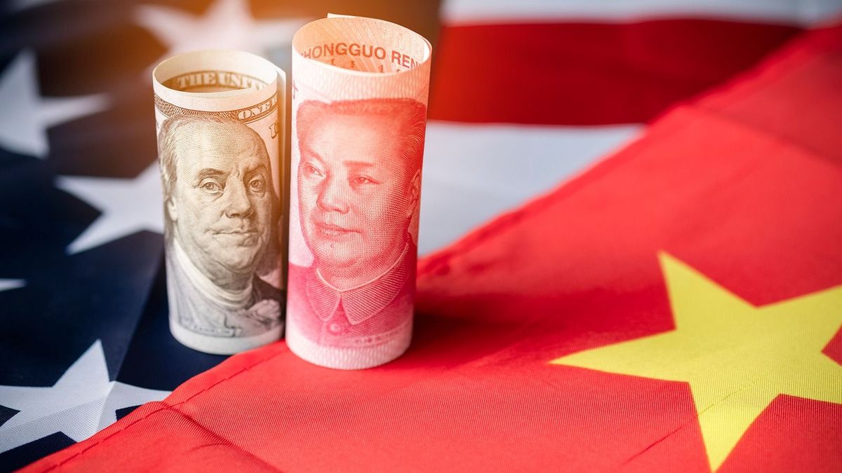 Us,Dollar,And,Yuan,Banknote,On,Usa,And,China,Flags.