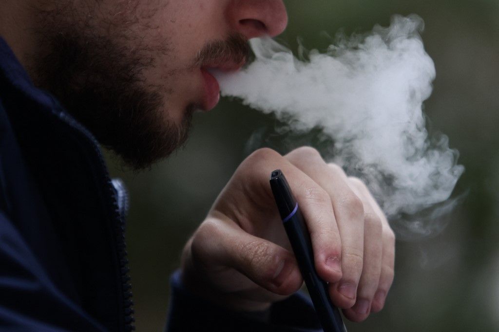 Electronic Cigarette Smoker In PolandA person smokes an electronic cigarette in Krakow, Poland on April 9, 2022. (Photo by Jakub Porzycki/NurPhoto) (Photo by Jakub Porzycki / NurPhoto / NurPhoto via AFP)