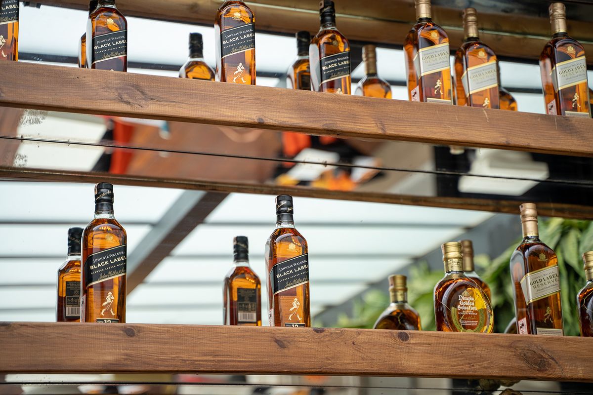 Johnnie,Walker,Black,Label,Whisky,Bottles,On,The,Bar,Shelf., whiskey