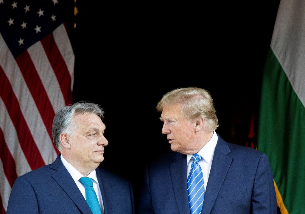 This handout photograph taken and released on March 8, 2024, by the Press Office of the Hungarian Prime Minister, shows Hungarian Prime Minister Viktor Orban (L) and former US President and Republican presidential candidate, Donald Trump during their meeting at Trump's Mar-a-Lago residence in Palm Beach, Florida. (Photo by ZOLTAN FISCHER / HUNGARIAN PRIME MINISTER'S OFFICE / AFP) / RESTRICTED TO EDITORIAL USE - MANDATORY CREDIT "AFP PHOTO / PRESS OFFICE OF THE HUNGARIAN PRIME MINISTER" - NO MARKETING NO ADVERTISING CAMPAIGNS - DISTRIBUTED AS A SERVICE TO CLIENTS