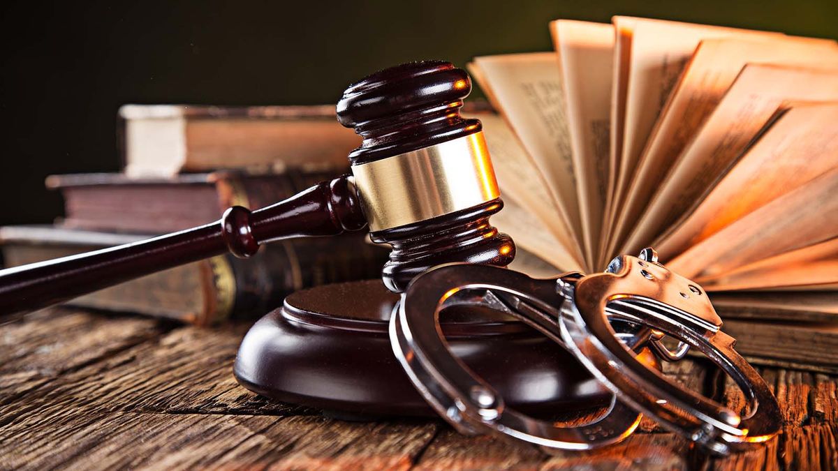 Wooden,Gavel,And,Books,On,Wooden,Table,,Law,Concept