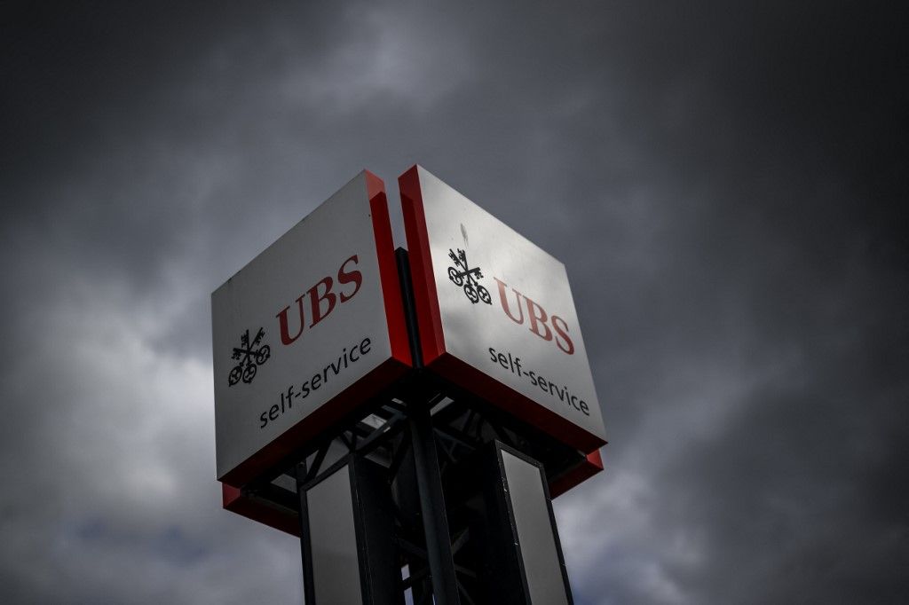 This photograph taken on February 19, 2024, shows a sign of Swiss giant banking UBS in Renens, western Switzerland. (Photo by Fabrice COFFRINI / AFP)