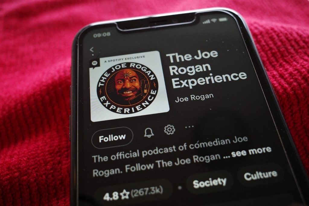 Spotify 
This illustration photo shows the Spotify page for "The Joe Rogan Experience" podcast displayed on a smart phone in Washington, DC on February 7, 2022. The head of music streaming giant Spotify Daniel Ek has condemned podcaster Joe Rogan's use of a racial slur but insisted that silencing him was not the answer. (Photo by MANDEL NGAN / AFP)