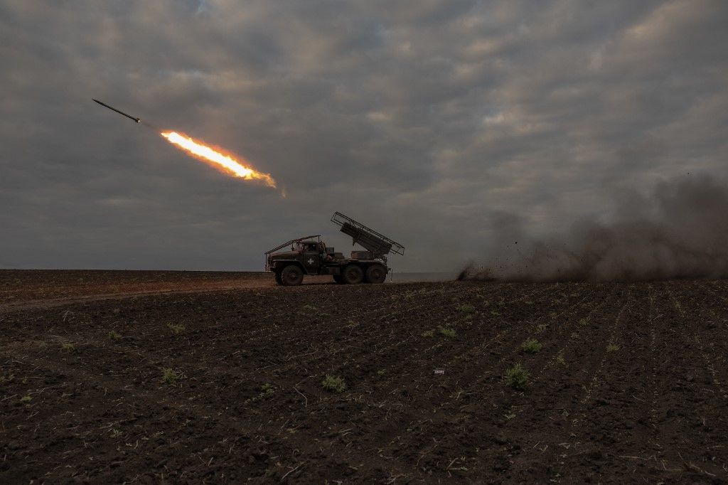 Ukrainian servicemen of the 92nd Assault Brigade fire BM-21 'Grad' multiple rocket launcher toward Russian positions, in the Kharkiv region, on May 15, 2024, amid the Russian invasion of Ukraine. President Volodymyr Zelensky cancelled planned trips abroad over the fresh offensive and the military was sending more troops to Kharkiv to hold back Russian advances, Kyiv said. (Photo by Roman PILIPEY / AFP)