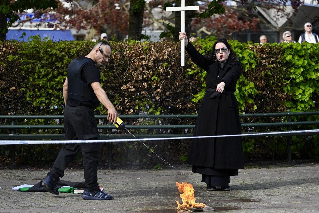 Salwan Najem and Jade Sandberg during a public gathering at Gustav Adolfs Torg in Malmö, on Friday, where they set fire to what is said to be a Koran. May 3, 2024.
Photo: Johan Nilsson / TT / Code 50090 (Photo by JOHAN NILSSON / TT NEWS AGENCY / TT News Agency via AFP)