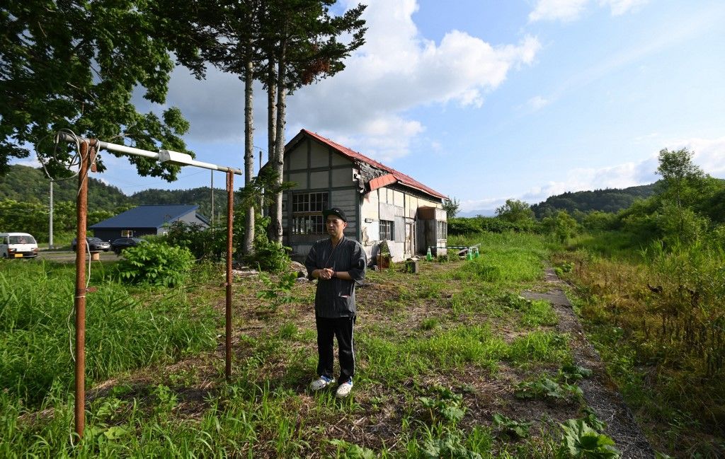 A photo shows an abandoned Soeushinai Station on the former JR Fukamei Line in Horokanai Town, Hokkaido Prefecture, northern Japan, on August 4, 2022. Akihito Yamamoto, the owner of a local soba (buckwheat noodle) restaurant, calls for donations for repair costs through crowdfunding in order to preserve the wooden station building.( The Yomiuri Shimbun ) (Photo by Taketo Oishi / Yomiuri / The Yomiuri Shimbun via AFP)