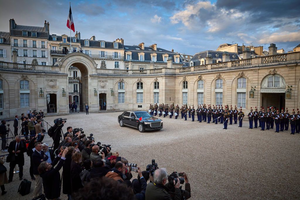 PARIS, FRANCE - MAY 06: President of France Emmanuel Macron (2nd L), his wife Brigitte Macron (L), stand on the steps of the Élysée Palace as they await the arrival of President of the People's Republic of China Xi Jinping and his wife Peng Liyuan for a State Dinner in their honour during the Chinese President's State Visit to France on May 06, 2024 in Paris, France. This visit marks the 60th anniversary of diplomatic relations between the two countries and follows the visit of the President Macron to Beijing and Canton in April 2023. (Photo by Kiran Ridley/Getty Images)