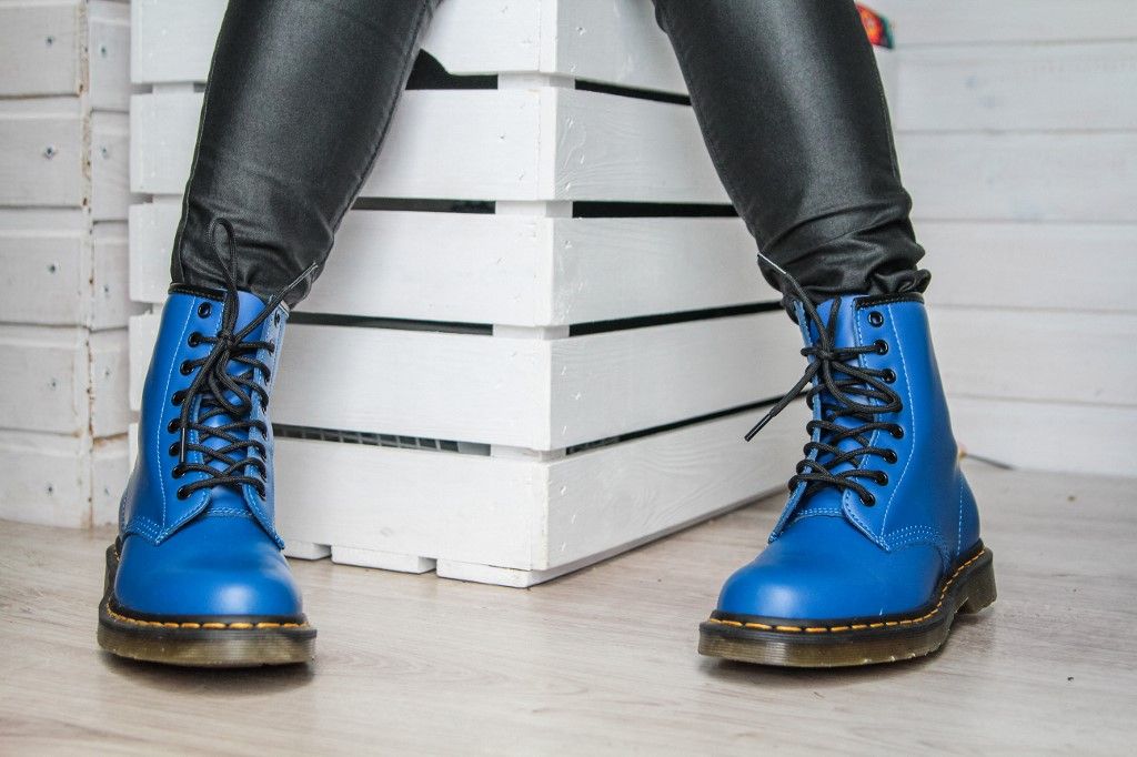 Dr Martens, Woman tries on her new pair of Dr. Martens 1460 Air Wair blue leather boots in Oslonino, Poland on 25 April 2020  (Photo by Michal Fludra/NurPhoto) (Photo by Michal Fludra / NurPhoto / NurPhoto via AFP)