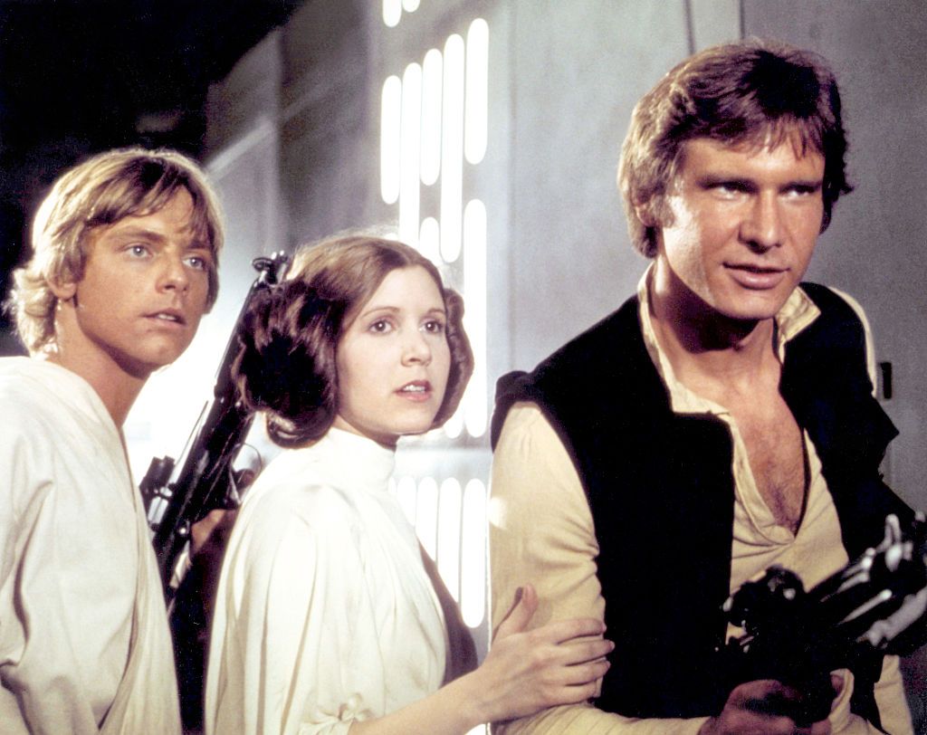 On the set of Star Wars: Episode IV - A New HopeAmerican actors Mark Hamill, Carrie Fisher and Harrison Ford on the set of Star Wars: Episode IV - A New Hope written, directed and produced by Georges Lucas. (Photo by Sunset Boulevard/Corbis via Getty Images)
