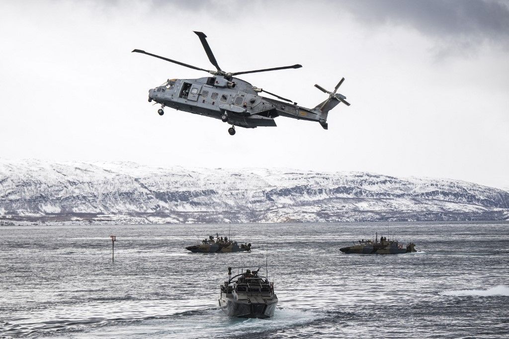 An amphibious assault demonstration with joint forces of the Swedish, Finnish, Italian and French army is pictured during the Nordic Response 24 military exercise on March 10, 2024, at sea near Sorstraumen, above the Arctic Circle in Norway. Nordic Response 24 is part of the larger NATO exercise Steadfast Defender. The exercise involves air, sea, and land forces, with over 100 fighter jets, 50 ships, and over 20,000 troops practicing defensive manoeuvres in cold and harsh weather conditions. (Photo by Jonathan NACKSTRAND / AFP)