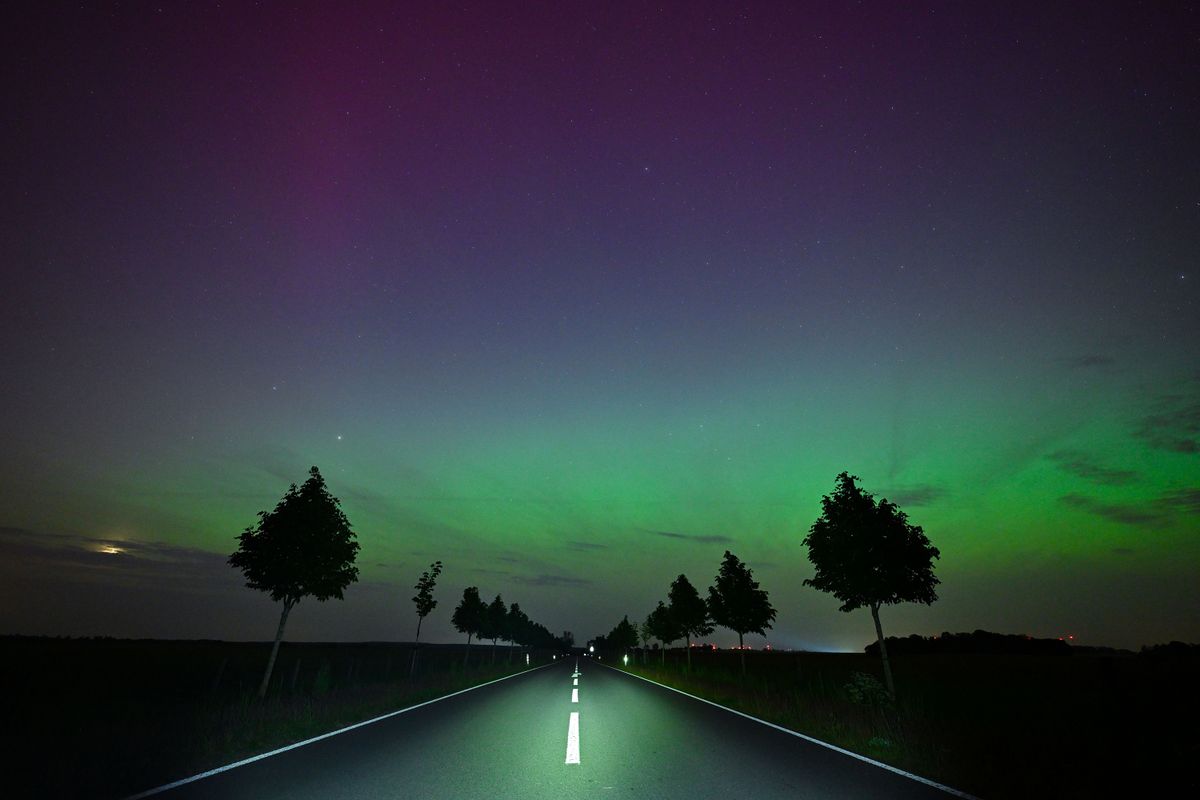 Northern lights shine in the night sky